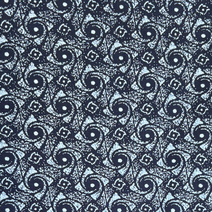 Blue patterned Shwe Shwe fabric close up