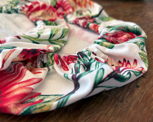 Close up of Protea of White Fabric -  Bowl Covers on wooden surface
