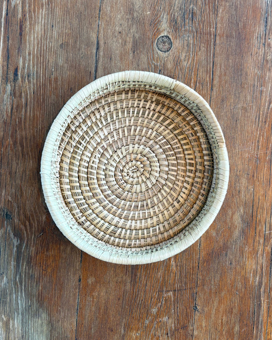 Round Woven Tray on wooden table